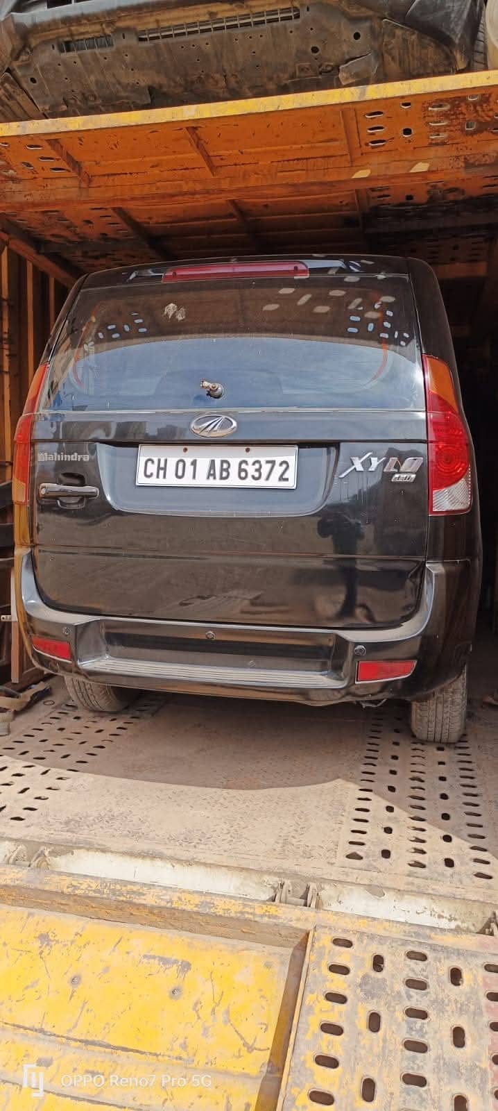 Vehicle transport — car inside enclosed carrier for long distance move