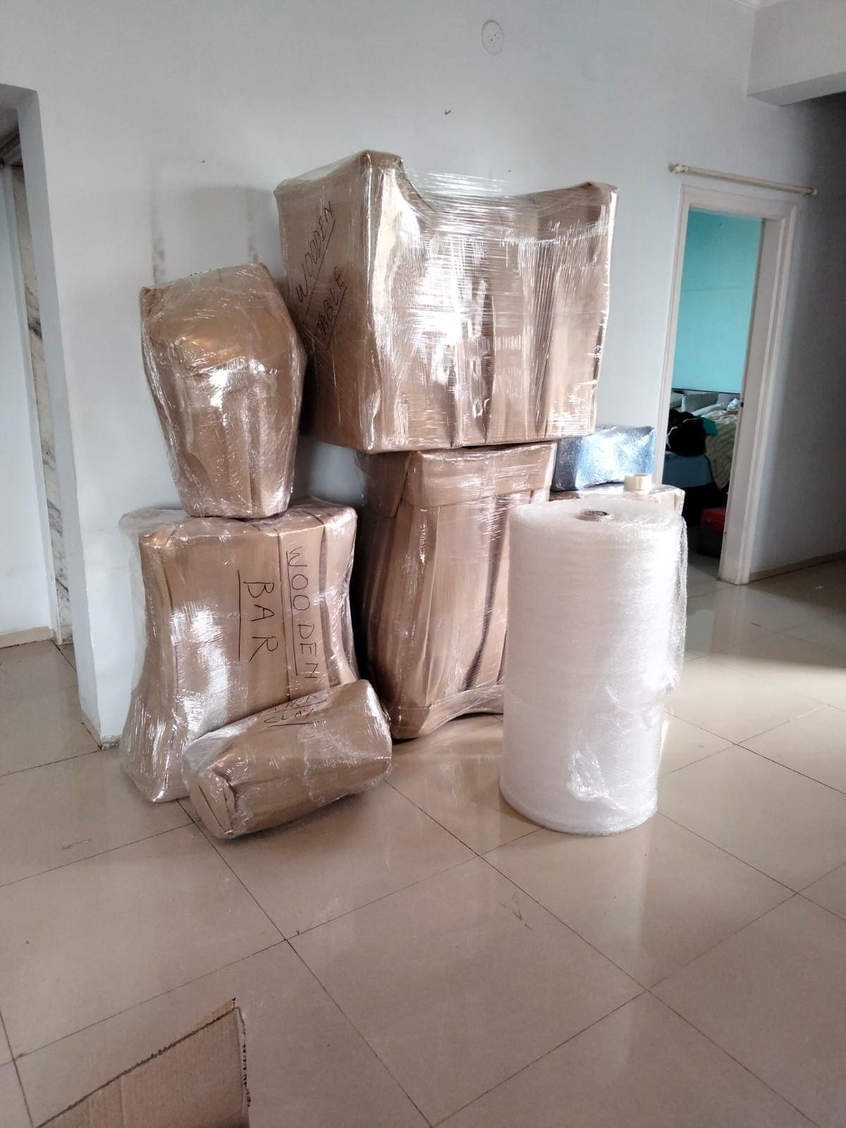 ShiftEzy crew packing furniture and fragile items with quality materials